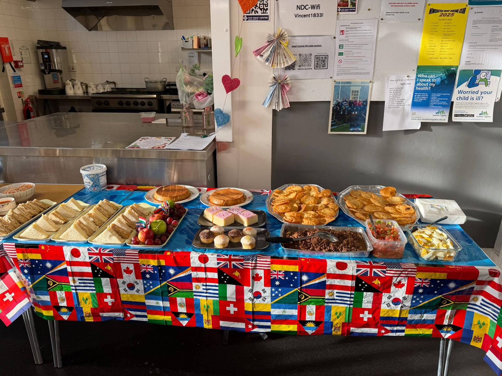 A shared table of cultural foods at a Roots for Change community event