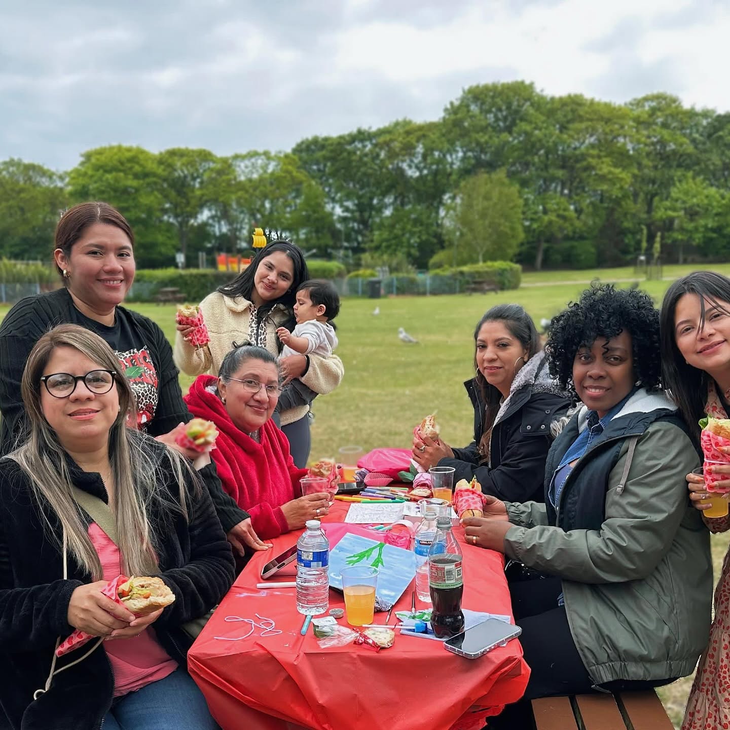 Women gathering together at a Roots for Change Mother’s Day celebration